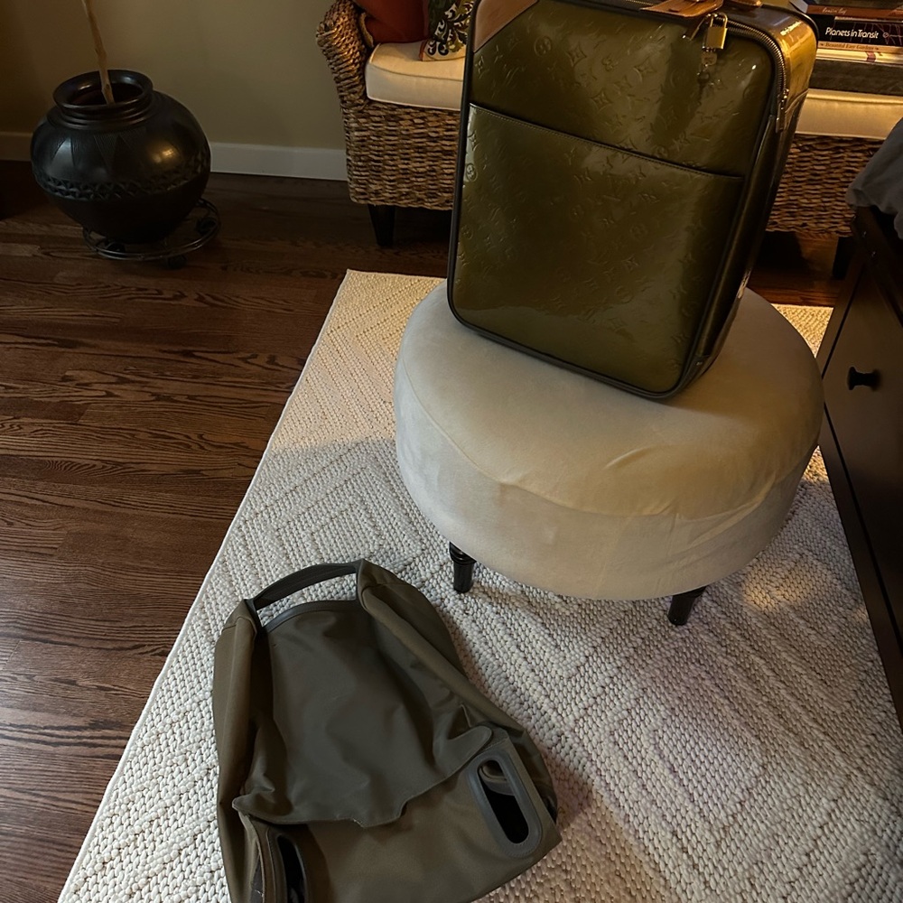 Pristine Louis Vuitton Olive suitcase with protective cover for traveling!